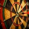 Precision strike in dart game, hitting bullseye, aiming for success