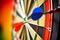Precision Strikes: Vibrant Darts Hit Bullseye on Dark Sisal Dartboard