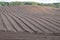 Precision tractor ploughed field in Cheshire, UK