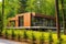 prefab house made of tan wood, placed among trees