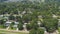 Prefab houses, manufactured, modular, and mobile homes with row of new development single family homes in distance background