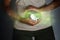 Pregnancy and abortion.The paper-cut silhouette of an embryo in a woman`s hands is surrounded by a greenish glow - an allegory of