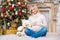 Pregnancy and Christmas, people and expectation concept - happy pregnant woman touching her belly.