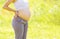 Pregnancy concept, the expectant mother outdoors