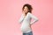 Pregnancy concept. Surprised black woman posing over pink background