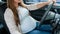 Pregnancy driving car. Young beautiful pregnant woman driving car. Safety pregnancy, mother health care concept.