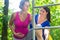 Pregnancy exercise sport at climbing frame with two women