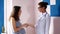 Pregnancy, gynecology, medicine, health care and people concept - gynecologist doctor and pregnant woman meeting at