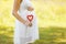 Pregnancy, maternity, family - concept, pregnant woman and heart