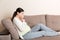 Pregnancy Morning Sickness. Pregnant Woman Having Nausea Feeling Bad in Sofa at the Home