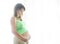 Pregnancy, motherhood- close up of happy pregnant woman