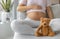 Pregnancy. Pregnant woman wearing maternity clothes relaxing on home sofa with teddy bear baby toy in focuse for baby