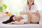 Pregnancy spa. Massage for pregnant woman