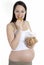 Pregnancy woman eating Ginger biscuit