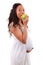 Pregnant african american woman eating an apple