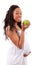 Pregnant african american woman eating an apple