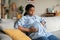 Pregnant African Woman Suffering From Pain Having Spasm At Home