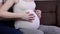 Pregnant belly with hands of mother and father. Baby expecting. Pregnant woman. Pregnancy concept