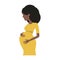 Pregnant black woman in yellow dress isolated on a white background