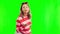 Pregnant, blowing kiss and a happy woman on a green screen with a smile, hope or love. Female person portrait with hand