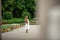 Pregnant brunette woman at an old building gazebo