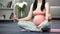 Pregnant doing lotus pose yoga for future mum caring about mental health of baby