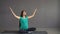 Pregnant ethnic girl engaged in yoga sitting in a lotus pose. Indian woman with hindi.