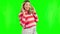 Pregnant, fingers crossed and a woman on a green screen with a wish, hope and love. Female person portrait with smile