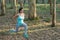 Pregnant fitness woman doing lunges outdoor