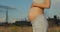 Pregnant girl on the background of an enterprise polluting the atmosphere. The concept of global pollution of the