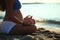 Pregnant girl doing yoga sand beach sea morning