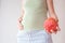 Pregnant girl with fruits. The concept of bearing healthy offspring, replenishing vitamin deficiencies during pregnancy and