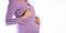 A pregnant girl in a purple blouse holds her chest. The concept of pain and changes in the female breast in pregnant women due to