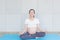 Pregnant is having fun doing yoga. pregnant woman meditating and practicing yoga