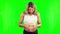 Pregnant, heart and stomach of a happy woman on a green screen with a smile, hope and love. Excited female person with