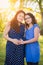 Pregnant Hispanic Mother and Her Daughter Portrait In Rural Setting