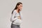 Pregnant Lady Feeling Sick Having Nausea Standing On Gray Background