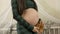 Pregnant mother rubs her very big belly,