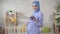 Pregnant Muslim woman in a hijab looking at the camera