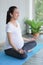 Pregnant smile. A pregnant woman doing meditation and yoga in the living room