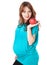 A pregnant smiling woman is holding an apple