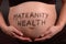 Pregnant Tummy with Maternity Health written on