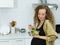 pregnant vegetarian woman smile, happy, stand, eat vegetable, look at vegetable salad cup in kitchen with copy space. beautiful