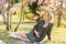 Pregnant white woman sitting on grass