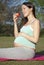 Pregnant woman with apple