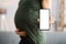 Pregnant Woman With Baby Showing Blank Phone Screen