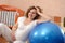 Pregnant woman with ball