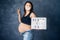 pregnant woman being silly and enjoying life - pregnancy and motherhood concept