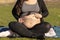 Pregnant woman belly with seven month mark