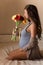 Pregnant woman with a bouquet of flowers , pregnancy, motherhood, waiting for a miracle, pregnant belly